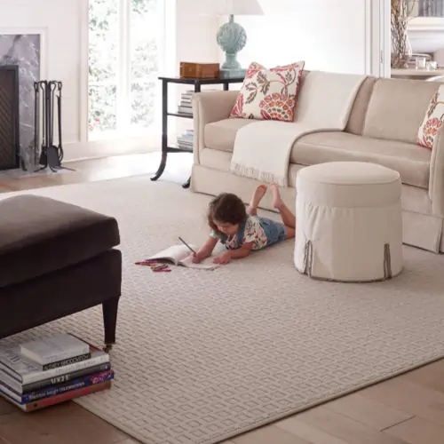 Girl lying on rug | J Lane Flooring & Design, Inc.